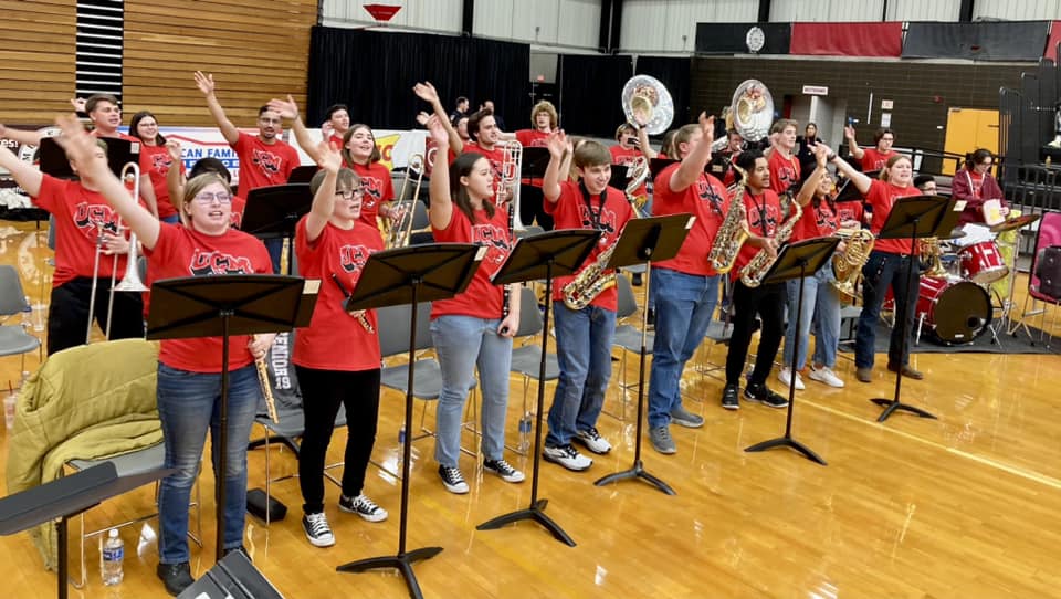 UCM Pep Band plays at a basketball game.