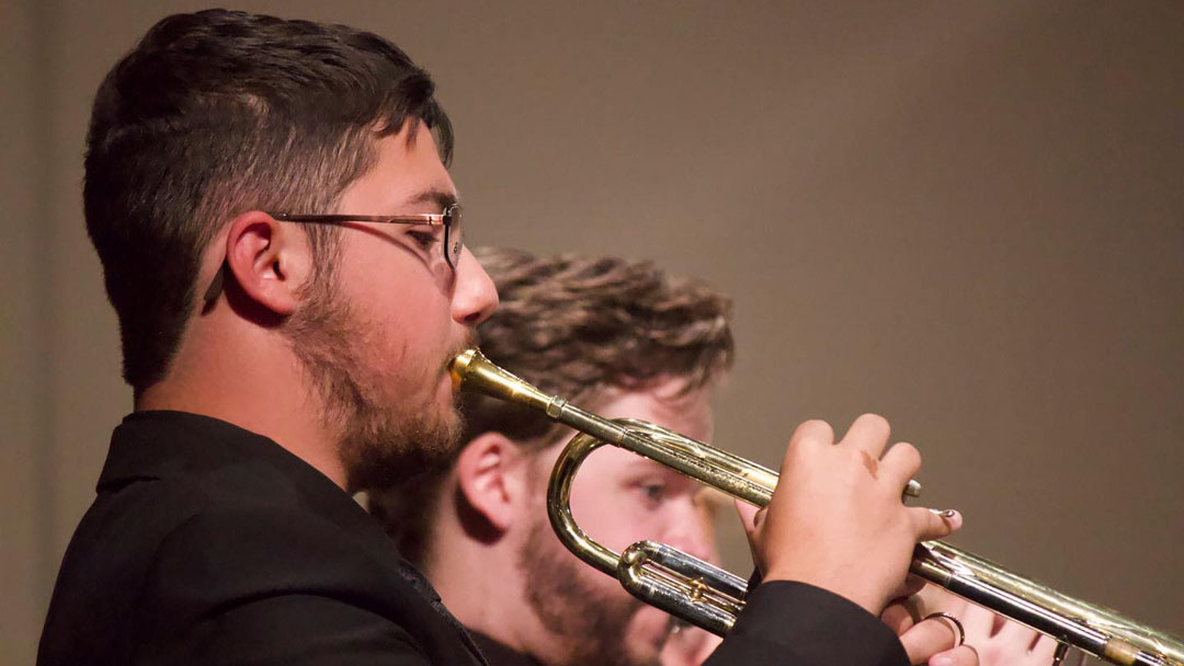 Close up on a trumpeter in the UCM Symphonic Band